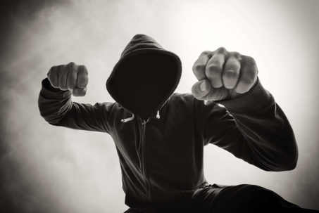 Person in a hoodie with hands in fists